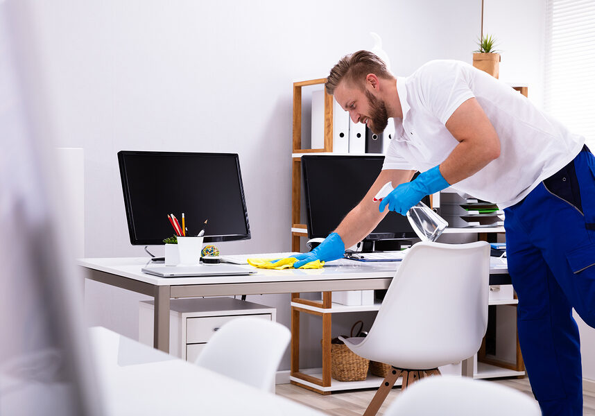 man cleaning the minimalist office room